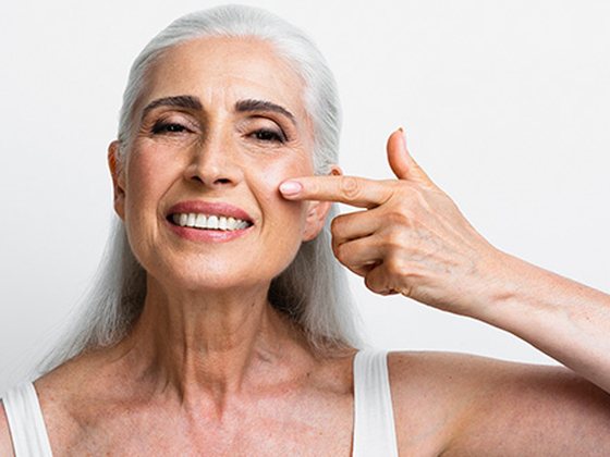Happy older patient smiling with healthy skin